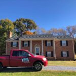 BTB Construction Company Truck in front of a client's home that has a new roof completed by the team at BTB Construction