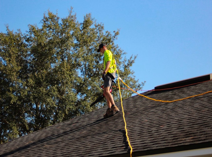 Roofing contractor preparing documentation for HOA review