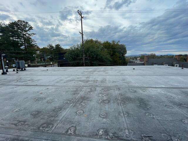 a flat roof in lynchburg va that BTB Construction is working on during a nice cloudy day