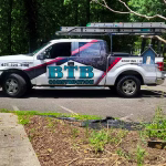 btb construction work truck wrapped with the company logo in large lettering square ratio